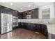 Well-equipped kitchen with stainless steel appliances and dark cabinetry at 3266 Yale Dr, Broomfield, CO 80023