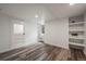 Basement area featuring wood-look floors, recessed lighting, and built-in shelving at 1010 Euclid Ave, Boulder, CO 80302