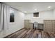 Finished basement bedroom with recessed lighting, wood-look floors, and plenty of natural light at 1010 Euclid Ave, Boulder, CO 80302