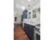 Kitchen features shaker cabinets, marble countertops, stainless steel appliances, tile backsplash and hardwood flooring at 1010 Euclid Ave, Boulder, CO 80302