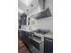 Kitchen features shaker cabinets, marble countertops, stainless steel appliances, and tile backsplash at 1010 Euclid Ave, Boulder, CO 80302