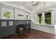 Bright living room features hardwood floors, a fireplace, large windows, and modern lighting at 1010 Euclid Ave, Boulder, CO 80302