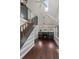 Cozy living room with a fireplace, hardwood floors, a skylight, and access to a staircase with built-in shelving at 1010 Euclid Ave, Boulder, CO 80302