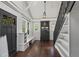 Bright living room with hardwood floors, staircase, custom cabinet and an entry door at 1010 Euclid Ave, Boulder, CO 80302