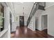 Open living room featuring hardwood floors, staircase, and custom built-in cabinet at 1010 Euclid Ave, Boulder, CO 80302