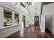Bright living room with hardwood floors, stairs, custom built-in seating and cabinet at 1010 Euclid Ave, Boulder, CO 80302