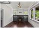 Cozy living room features hardwood floors, a fireplace, windows, and modern chandelier at 1010 Euclid Ave, Boulder, CO 80302