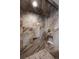 Stylish shower with decorative brown tile surround, and integrated storage shelves at 1010 Euclid Ave, Boulder, CO 80302