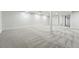 Spacious basement with neutral carpet and ample lighting offers versatile living space at 3067 Robin Way, Denver, CO 80222