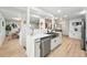 Modern kitchen featuring stainless steel appliances, a sleek sink, and ample counter space at 3067 Robin Way, Denver, CO 80222