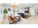 Bright, open living area featuring a fireplace, dining table, and comfortable seating at 3067 Robin Way, Denver, CO 80222