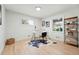 Office area with natural light from the large windows and stylish modern furnishings at 3067 Robin Way, Denver, CO 80222