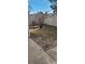 Small backyard with a privacy fence and small tree at 9703 W Chatfield Ave # H, Littleton, CO 80128