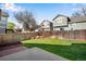 Backyard featuring a grassy lawn, patio, garden box, and privacy fence at 12535 Forest View St, Broomfield, CO 80020