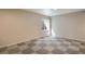 Basement with large checkered flooring and window at 12535 Forest View St, Broomfield, CO 80020
