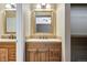 This bathroom features double sinks with lovely vanities and modern fixtures at 12535 Forest View St, Broomfield, CO 80020