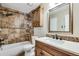 Bathroom with a shower/tub combination with tile and an updated vanity at 12535 Forest View St, Broomfield, CO 80020
