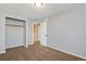 Bedroom with closet and door, neutral walls and carpeting at 12535 Forest View St, Broomfield, CO 80020