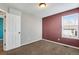 Bedroom with natural light, neutral carpet and ceiling light at 12535 Forest View St, Broomfield, CO 80020