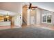 Bright, open entryway showing access to the kitchen and stairs, bathed in natural light with modern fixtures at 12535 Forest View St, Broomfield, CO 80020