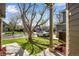 Inviting front yard with lush green grass, a mature tree, and a charming view of the neighborhood at 12535 Forest View St, Broomfield, CO 80020