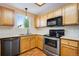 This kitchen features light wood cabinets, white countertops, and stainless steel appliances at 12535 Forest View St, Broomfield, CO 80020