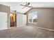 The main bedroom boasts vaulted ceilings, carpet floors, and an ensuite bathroom at 12535 Forest View St, Broomfield, CO 80020