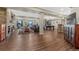 Spacious finished basement with a stone fireplace, home gym, pool table, and multiple seating areas at 2601 Loyd Cir, Parker, CO 80138