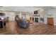 Finished basement with stone fireplace, built-in shelving, and hardwood flooring creates a cozy living space at 2601 Loyd Cir, Parker, CO 80138