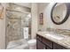 Elegant bathroom features a tiled shower with glass enclosure and granite countertop vanity at 2601 Loyd Cir, Parker, CO 80138