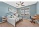 Serene bedroom with light blue walls, carpet, and bright windows with shutter-style blinds at 2601 Loyd Cir, Parker, CO 80138