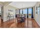 Elegant dining area with hardwood floors, a stylish light fixture, and a large window at 2601 Loyd Cir, Parker, CO 80138