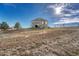 An exterior shot of the back of the property showing a large back yard at 2601 Loyd Cir, Parker, CO 80138