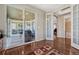 Spacious hallway with access to a screened patio, bathroom, and other living areas at 2601 Loyd Cir, Parker, CO 80138