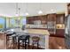 Spacious kitchen with stainless steel appliances, hardwood floors, granite countertops, and a center island at 2601 Loyd Cir, Parker, CO 80138