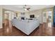 Open concept living room with hardwood floors, a fireplace, and an oversized sectional sofa at 2601 Loyd Cir, Parker, CO 80138