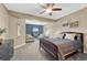 Comfortable main bedroom with sitting area, neutral color scheme and plenty of natural light at 2601 Loyd Cir, Parker, CO 80138