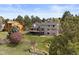 Aerial view of the home featuring a backyard with mature trees and a lush green lawn at 7575 E Windlawn Way, Parker, CO 80134