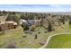 Aerial view of the property showcasing its well-manicured lawn, mature trees, and convenient location at 7575 E Windlawn Way, Parker, CO 80134