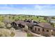 Stunning clubhouse exterior with stone accents and well-manicured landscaping at 7575 E Windlawn Way, Parker, CO 80134