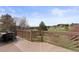 Large wooden deck with railings and views of the golf course and landscape at 7575 E Windlawn Way, Parker, CO 80134