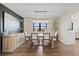 Elegant dining room featuring a modern chandelier, wine rack, and hardwood floors at 7575 E Windlawn Way, Parker, CO 80134