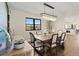 Inviting dining room featuring a modern chandelier, wine rack, and hardwood floors at 7575 E Windlawn Way, Parker, CO 80134