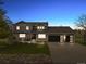 Charming two-story home with a three car garage, a seating area, and an illuminated walkway at 7575 E Windlawn Way, Parker, CO 80134