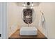 Elegant powder room with decorative mirror, modern sink, and stylish decor at 7575 E Windlawn Way, Parker, CO 80134