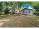 Spacious backyard with mature trees, picnic tables, hammock and swing for outdoor fun at 362 Brigitte Dr, Northglenn, CO 80260