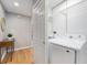 Laundry room with modern washer and dryer units and storage shelves at 362 Brigitte Dr, Northglenn, CO 80260