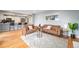Bright living area features an open-concept floor plan flowing into the modern kitchen at 362 Brigitte Dr, Northglenn, CO 80260