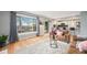 Open-concept living room flows to the backyard with views of the modern kitchen at 362 Brigitte Dr, Northglenn, CO 80260