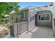 Back deck with wood railings, a pergola and views of backyard at 3871 E Euclid Ave, Centennial, CO 80121